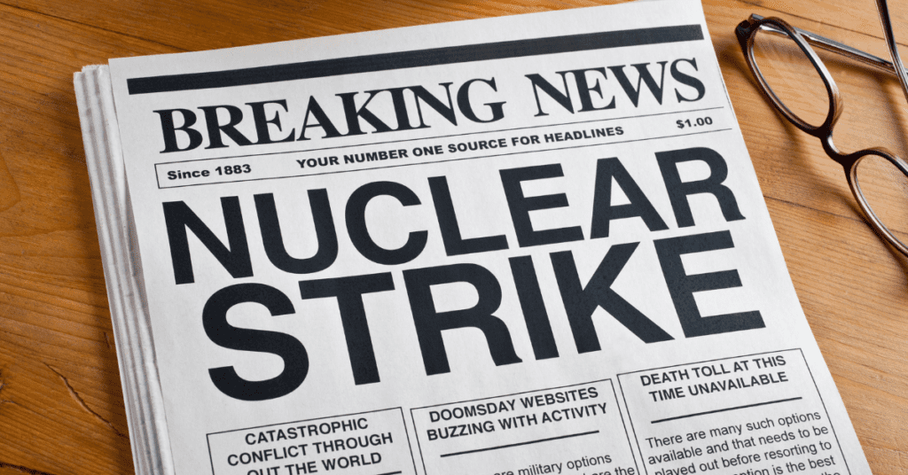 newspaper with bold text announcing a nuclear attack
