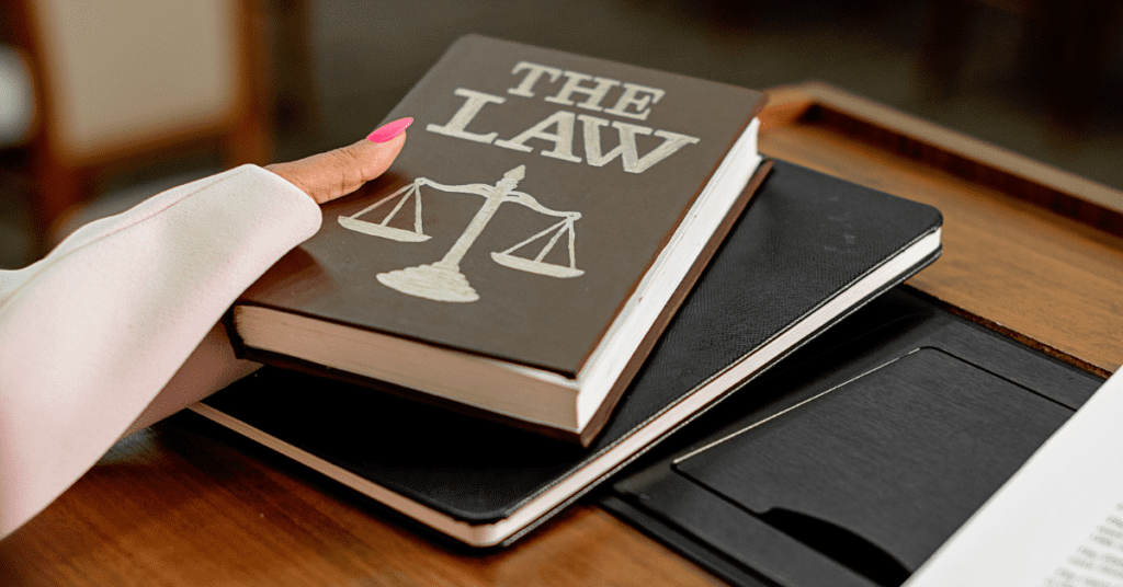woman holding a law book