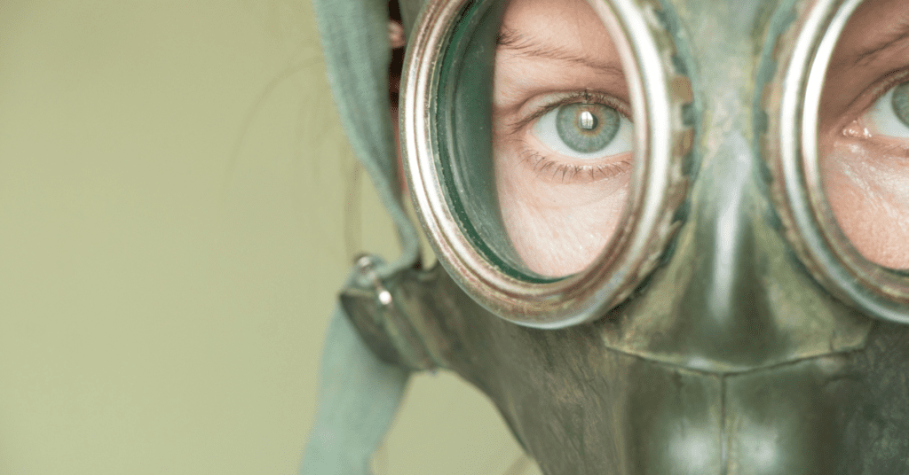 a military wearing a gas mask